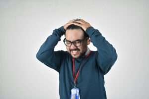 Photo by ahmad gunnaivi man in bluee ssweater